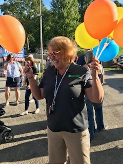 Tara holding balloons at Stoneboro Fair