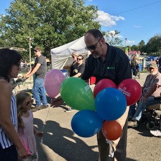 Steve Miller holding balloons at Stoneboro Fair 2019